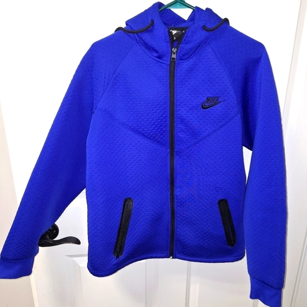 A Nike hooded full zip men's small jacket in blue. It's in excellent condition